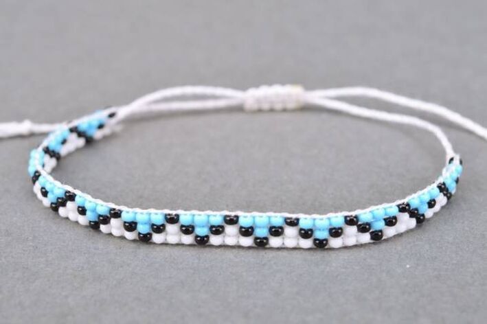 A bracelet made of threads and beads is a talisman that will bring good luck to the owner